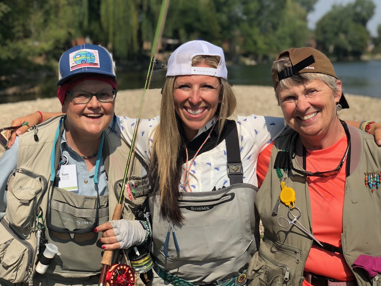 Friends Learning To Fly Fish On A River. 
