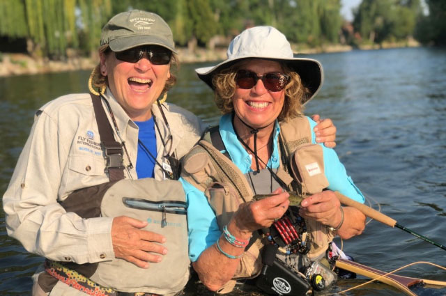 Fishing partners laughing